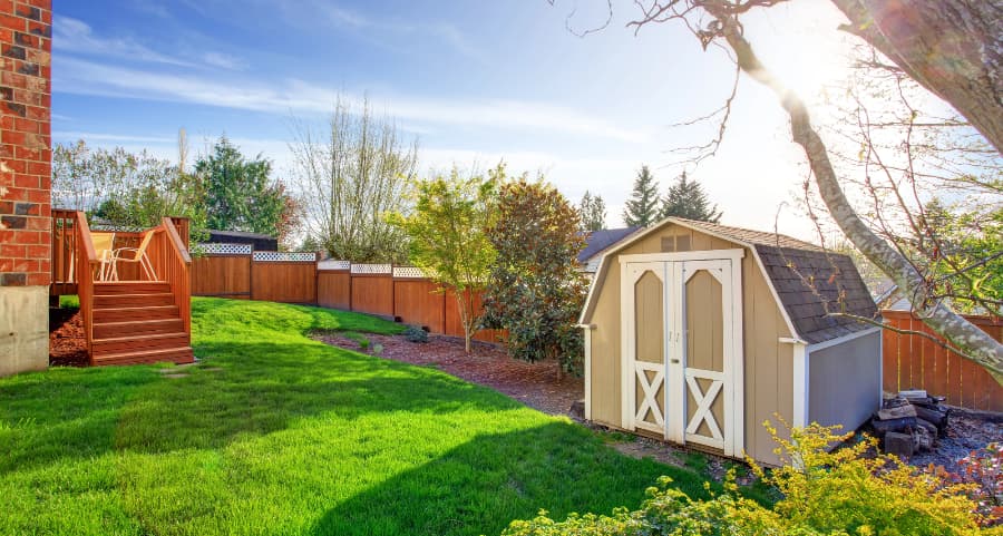 Fenced backyard with storage shed in Cleveland